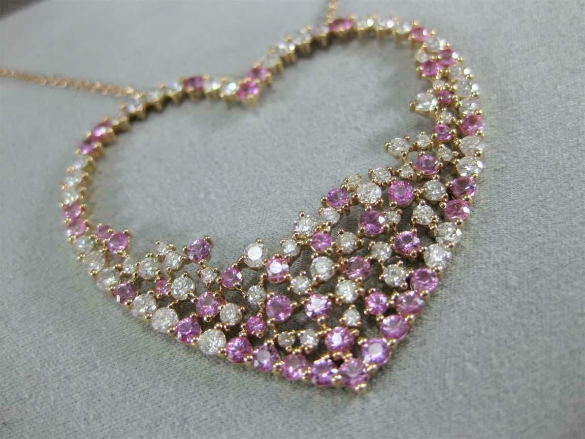 Timeless heart-shaped pendant with sparkling pink and white CZ stones in 925 silver.