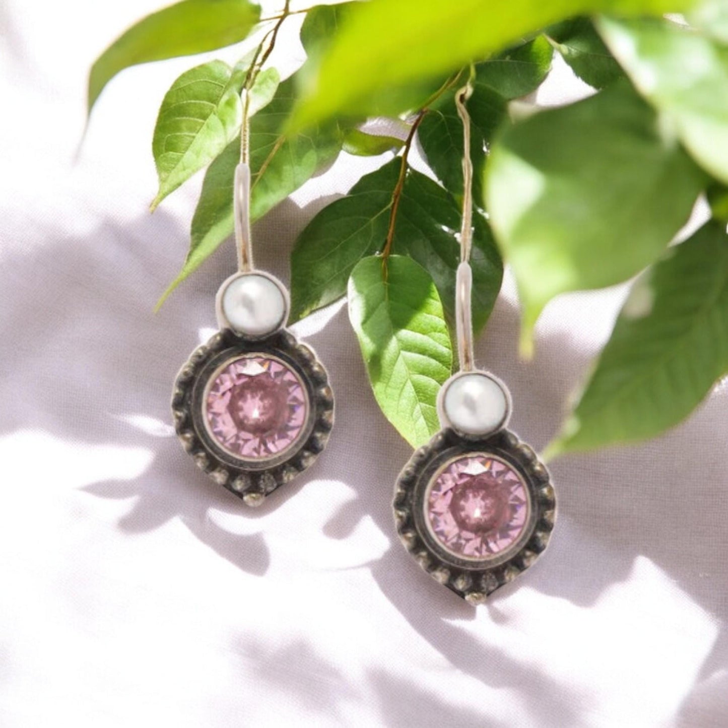Elegant 925 sterling silver earrings featuring oxidized pearls and vibrant pink CZ stones, a handcrafted statement piece.&quot;