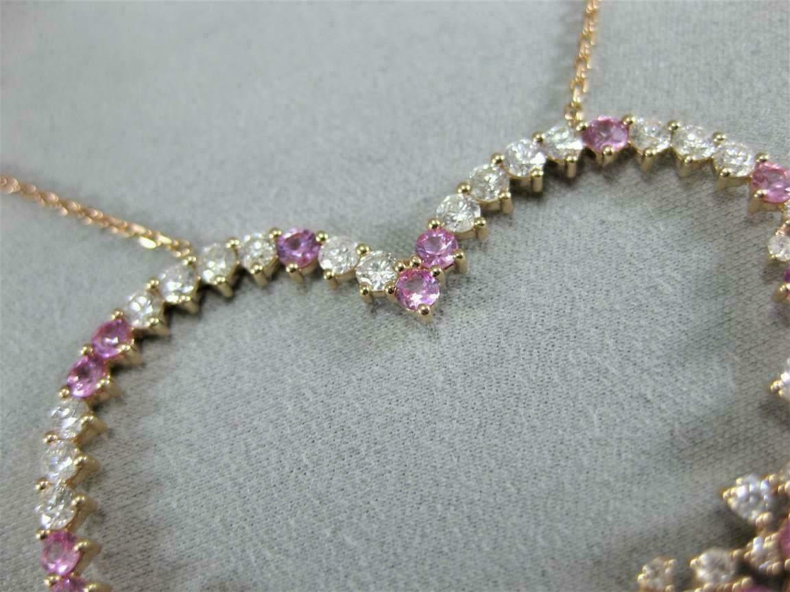 Sterling silver heart pendant with a vibrant fuchsia pink CZ gemstone for her.