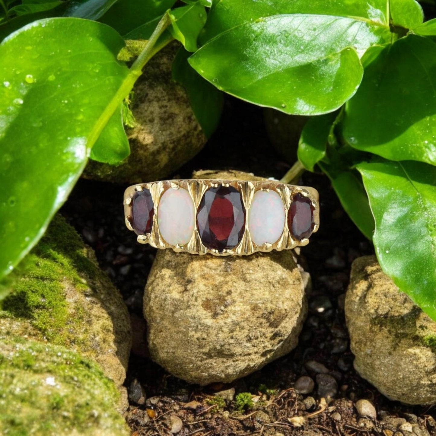 Vintage-inspired unisex ring featuring an oval-cut red garnet and opal in a gold-plated silver setting.