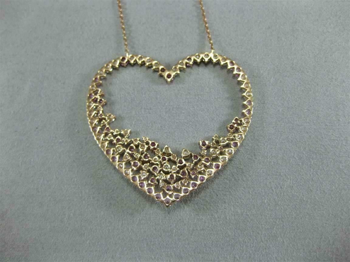 Romantic fuchsia pink CZ heart pendant with white CZ accents in sterling silver